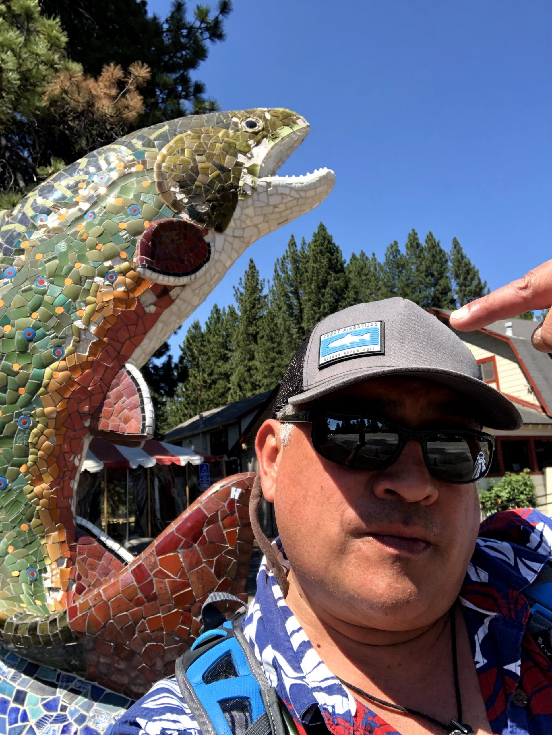 man in cap with trout